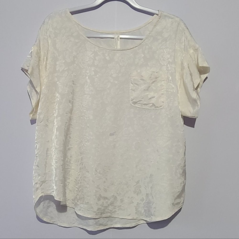 Anthropologie ivory floral print short sleeve blouse with